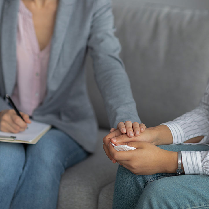 An image depicting Yessenia Lajara, a therapist and yoga counselor based in New York, engaged in a counseling session with a client